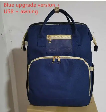 Diaper bag with pull out bed
