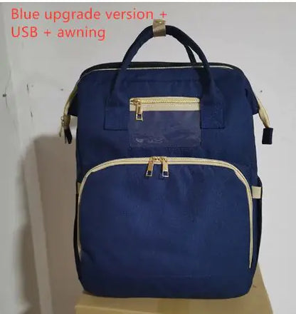 Diaper bag with pull out bed