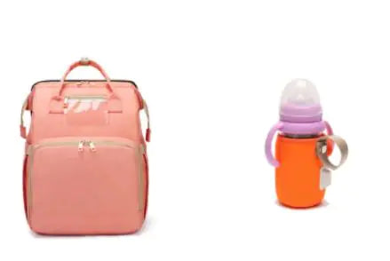Diaper bag with pull out bed